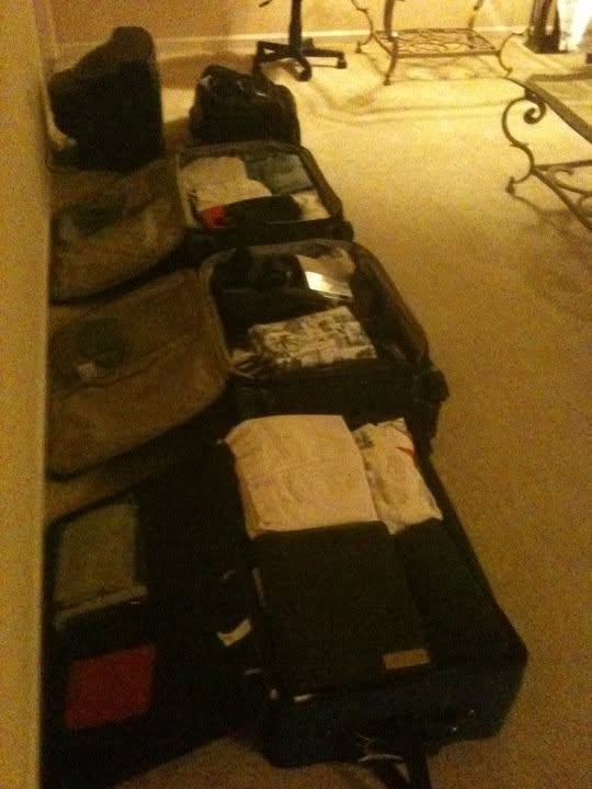 Open suitcases packed with clothes before the first trip to the Philippines in November 2010.