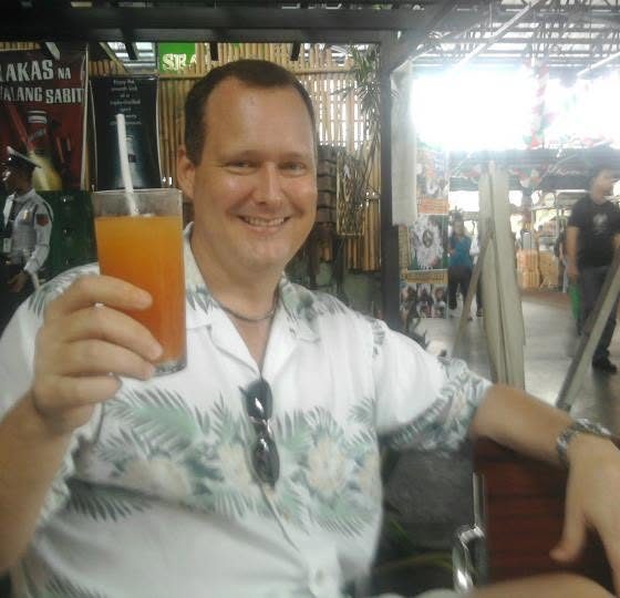 Steve and Cirila smiling close together in a selfie at Market Market at Serendra.